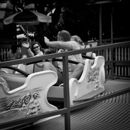 couple waving to each other on ride at Hershey Park